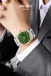 Men's quartz watch detail showcasing green textured dial, gold bezel and steel strap.
