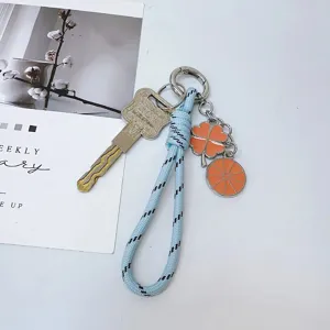 Sleutelhanger tas hanger met klaverblad met vier bladeren en blauw geweven koord.