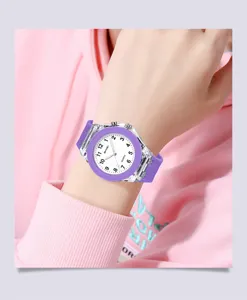 Close-up of kids purple silicone quartz watch detail with transparent case and clear dial.