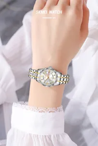Montre quartz femme bracelet metal bicolore chiffres romains calendrier bracelet