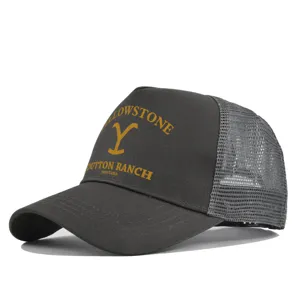 Detailed view of the dark grey mesh trucker cap featuring front Dutton Ranch print and logo.