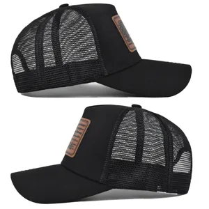 Detail view of black mesh trucker hat with brown leather patch, breathable summer cap.
