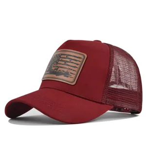 Burgundy mesh baseball cap with brown leather hunting patch, breathable trucker hat for summer.