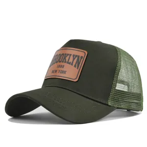 Green mesh trucker baseball cap with stylish brown leather patch for summer sun protection.