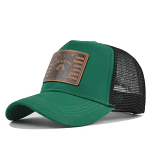 Green mesh trucker hat featuring a detailed raccoon leather patch and curved brim design.