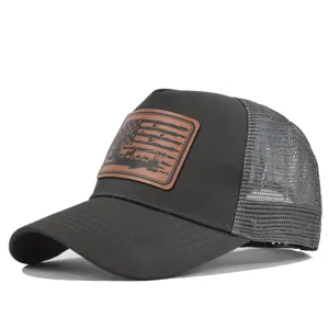 Black mesh trucker hat featuring a stylish brown leather patch for outdoor sports and summer.