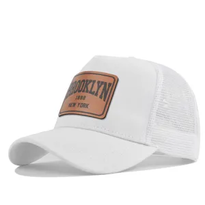 White mesh trucker hat with brown leather patch, breathable summer casual baseball cap for men.