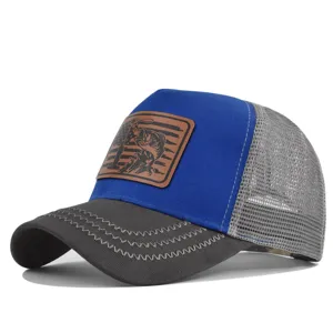Detail view of stylish blue grey fishing mesh baseball cap with premium leather patch and design.