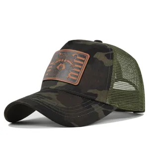 Camouflage trucker baseball cap with a brown leather raccoon patch, mesh back for summer.