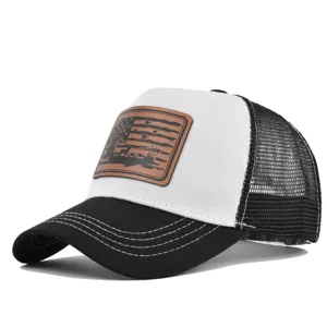 Classic black and white mesh trucker hat with brown leather hunting patch detail.