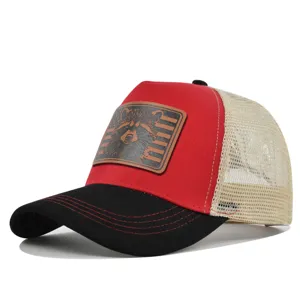 Red and black trucker hat with mesh back and leather raccoon patch for summer outdoor wear