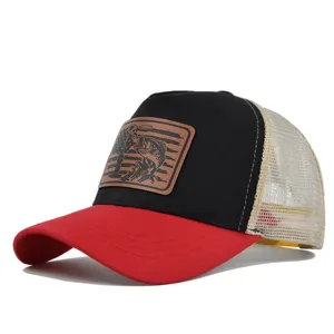 Detailed view of the mesh trucker baseball cap featuring a stylish leather fish patch.