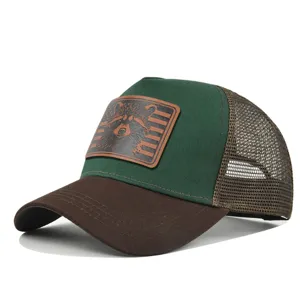 Close-up detail of the breathable mesh back and stylish leather patch on the front cap.