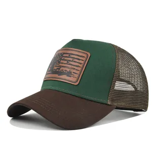 Outdoor hunting mesh baseball cap detail showing brown leather patch and breathable trucker back.