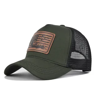 Detail view of tactical mesh baseball cap with brown leather hunting patch and breathable back.