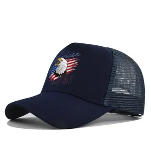 Close-up detail of the dark blue trucker hat featuring a detailed American eagle print and mesh back.