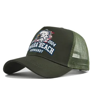 Army green trucker hat detail, featuring an eagle print and Omaha Beach Normandy text design.