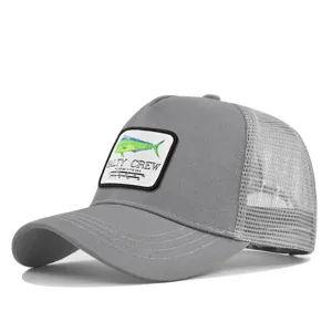 Detailed view of the grey trucker hat featuring the Salty Crew fish patch and breathable mesh back.