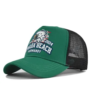 Detail view of the green mesh trucker cap featuring front embroidery and breathable back.