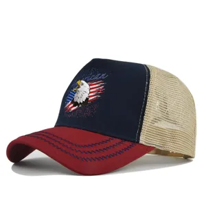 Detailed view of mesh trucker hat with eagle print, red brim and breathable back.