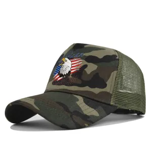 Close-up detail of camouflage mesh trucker hat featuring front American eagle graphic print.
