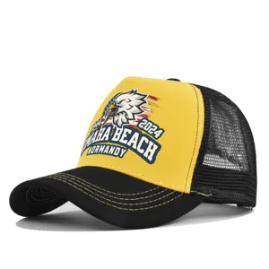 Detailed view of the yellow and black mesh baseball cap featuring front eagle print and brim stitching.