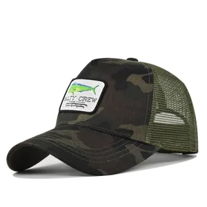 Close-up product detail showing the camo mesh cap with embroidered fish patch logo.