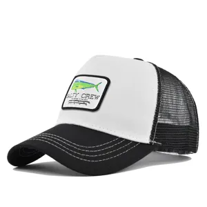 Detailed close-up view of the black and white trucker hat featuring a fishing logo patch.