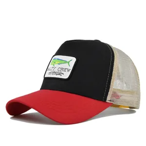 Salty Crew mesh trucker hat with fish embroidered patch, red brim and black front panel.