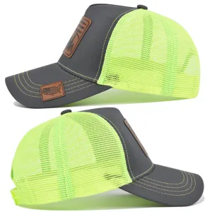 Detailed side view of the tactical mesh trucker hat featuring neon yellow back and leather patch.