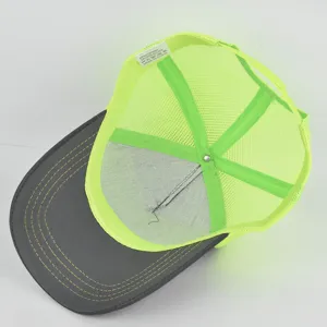 Detailed view of the interior structure and wash label of a casual summer mesh cap.