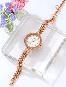 SKMEI rose gold women quartz watch with stylish bracelet strap and clear white dial detail.