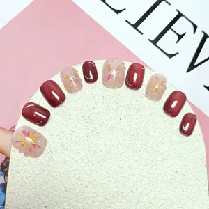Uñas postizas hechas a mano con efecto ojo de gato burdeos y diseños florales 3D elegantes.