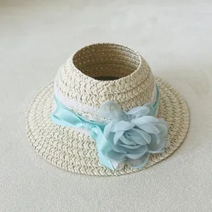 Exquisite miniature doll straw hat accessory with blue chiffon flower and delicate lace trim.