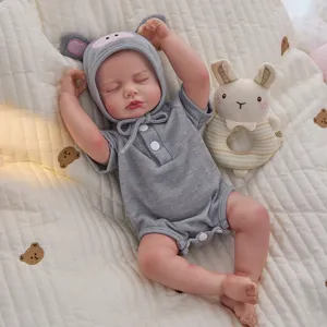 45cm realistic reborn baby doll with cute grey pig hat and soft vinyl body for kids play.