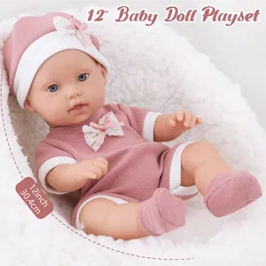 Close-up detail of 12-inch vinyl baby doll playset in cute pink outfit and matching hat.