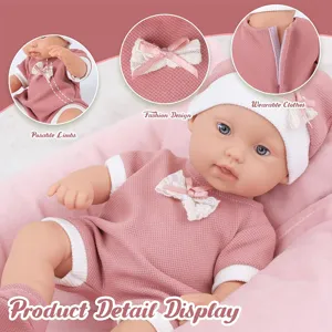 Reborn baby doll detail view showcasing cute pink outfit, movable limbs, and delicate lace bow.
