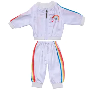 Close-up of doll sports tracksuit set with colorful rainbow stripes and zipper jacket.