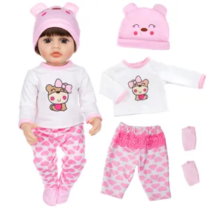 Detailed view of reborn doll clothes set with cute animal hat and heart pattern pants.