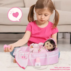 Detailed view of the pink doll bassinet set with cute plush bunny toy and baby bottle.