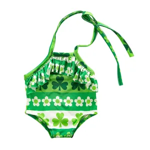 Detailed close-up view of the St. Patrick's Day green clover swimsuit for 18-inch fashion doll.