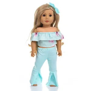 Close-up detail view of 18-inch doll outfit featuring floral top and stylish flare pants.