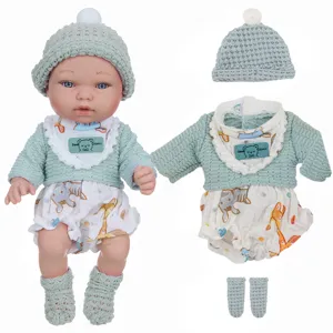 Details of 11-inch reborn baby doll with green knitted sweater outfit and clothing set.