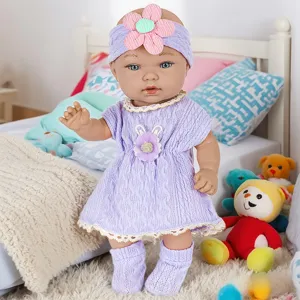 11-inch reborn baby doll toy with purple knitted dress headband and socks set for kids.