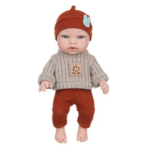 11 inch reborn baby doll toy with cute knit sweater and waffle hat outfit set details.