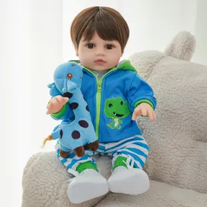 Reborn doll cute blue dinosaur hoodie and striped pants set detail view plush toy.
