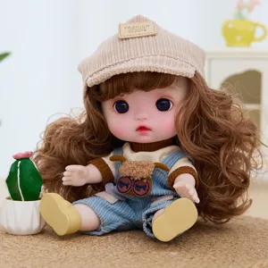 Cute 9-inch vinyl doll with curly hair and movable joints, perfect gift for little girls.
