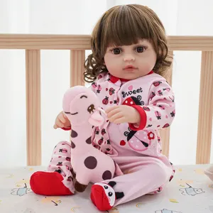 Cute 18-22 inch reborn baby doll clothes set with pink jumpsuit and adorable giraffe toy.