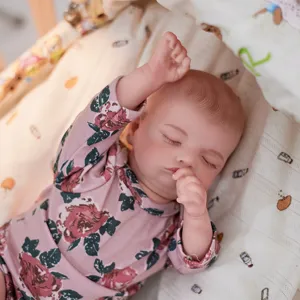 Close-up detail view of the cute pink floral reborn doll long-sleeve clothing outfit piece.
