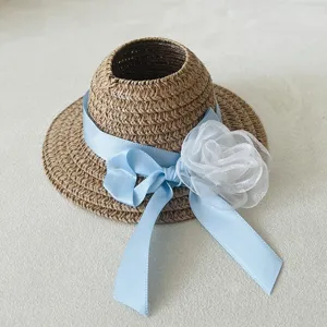 Miniature doll straw hat with blue ribbon and white flower, cute woven sun hat accessory for dolls.